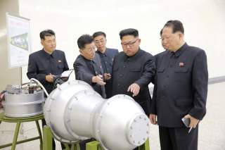  North Korean leader Kim Jong Un provides guidance with Ri Hong Sop (2nd L) and Hong Sung Mu (R) on a nuclear weapons program in this undated photo released by North Korea's Korean Central News Agency (KCNA) in Pyongyang September 3, 2017. KCNA via REUTER