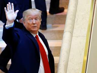 U.S. President Donald Trump waves as he arrives at the World Economic Forum (WEF) annual meeting in Davos, Switzerland January 26, 2018. REUTERS/Denis Balibouse