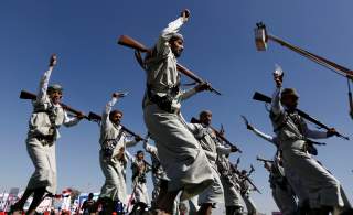 Houthi performers dance during a rally to mark the third anniversary of the Saudi-led intervention in the Yemeni conflict in Sanaa, Yemen March 26, 2018. REUTERS/Khaled Abdullah