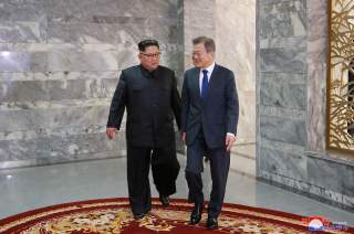 South Korean President Moon Jae-in meets with North Korean leader Kim Jong Un during their summit at the truce village of Panmunjom, North Korea, in this handout picture released by North Korea's Korean Central News Agency (KCNA) on May 27, 2018. KCNA/via