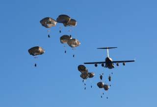 U.S. Army paratroopers leave C-17 aircraft to land during NATO exercise Swift Response 2018 on Adazi military ground, Latvia June 9, 2018. REUTERS/Ints Kalnins