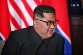 North Korean leader Kim Jong Un smiles next to U.S. President Donald Trump (not pictured) at the Capella Hotel on Sentosa island in Singapore June 12, 2018. Kevin Lim/The Straits Times