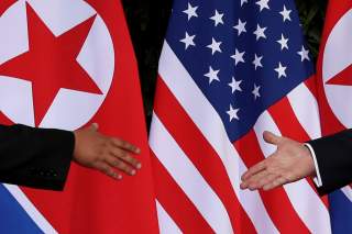 U.S. President Donald Trump and North Korea's leader Kim Jong Un meet at the start of their summit at the Capella Hotel on the resort island of Sentosa, Singapore June 12, 2018. Picture taken June 12, 2018. REUTERS/Jonathan Ernst