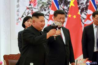 North Korean leader Kim Jong Un and Chinese President Xi Jinping raise a toast in Beijing, China, in this undated photo released June 20, 2018 by North Korea's Korean Central News Agency. KCNA via REUTERS ATTENTION EDITORS - THIS PICTURE WAS PROVIDED BY A