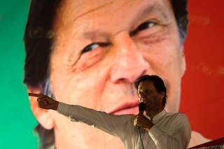 Imran Khan, chairman of the Pakistan Tehreek-e-Insaf (PTI) gestures while addressing his supporters during a campaign meeting ahead of general elections in Islamabad, Pakistan, July 21, 2018. REUTERS/Athit Perawongmetha