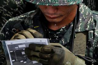 A bead of sweat is dripping off from a Taiwanese Marine from Underwater Demolition Company, Amphibious Reconnaissance Patrol Unit (ARP), before a night-time landing training, in Kaohsiung, Taiwan July 23, 2018. REUTERS/Tyrone Siu