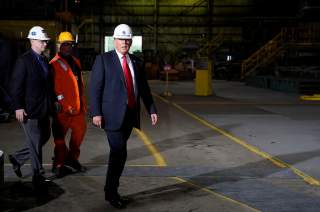 U.S. President Donald Trump wears a hardhat as he tours the Granite City Works hot strip steel mill in Granite City, Illinois, U.S., July 26, 2018. REUTERS/Joshua Roberts
