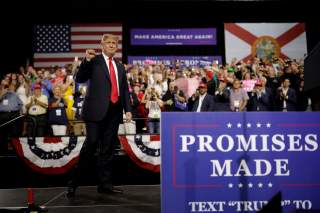 U.S. President Donald Trump acknowledges the crowd during the Make America Great Again rally at the Florida State Fairgrounds in Tampa, Florida, U.S., July 31, 2018. REUTERS/Carlos Barria TPX IMAGES OF THE DAY