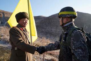 Soldiers from North and South Korea verify the removal of guard posts on each side of the Demilitarized Zone, December 12, 2018. South Korean Defence Ministry/Handout via REUTERS THIS IMAGE HAS BEEN SUPPLIED BY A THIRD PARTY.