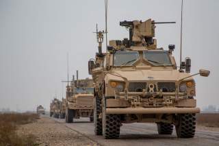 A Coalition convoy of U.S. led international coalition against the Islamic State of Iraq and the Levant (ISIL) stops to test fire their M2 machine guns and MK19 grenade launcher in the Middle Euphrates River Valley in the Deir ez-Zor province, Syria, Nove