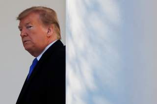 U.S. President Donald Trump heads back to the Oval Office after declaring a national emergency at the U.S.-Mexico border during remarks about border security in the Rose Garden of the White House in Washington, U.S., February 15, 2019. REUTERS/Carlos Barr