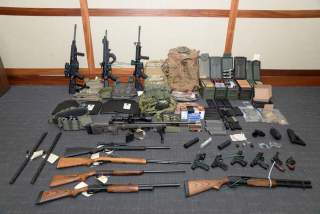 A cache of guns and ammunition uncovered by U.S. federal investigators in the home of U.S. Coast Guard lieutenant Christopher Paul Hasson in Silver Spring, Maryland, U.S., is shown in the photo provided February 20, 2019. U.S. Attorney's Office Maryland/H