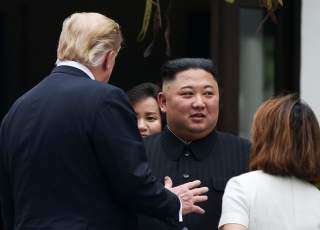 North Korea's leader Kim Jong Un and U.S. President Donald Trump talk at the Metropole hotel during the second North Korea-U.S. summit in Hanoi, Vietnam February 28, 2019. REUTERS/Leah Millis