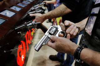 A man handles a Ruger revolver during the National Rifle Association (NRA) annual meeting in Indianapolis, Indiana, U.S., April 27, 2019. REUTERS/Lucas Jackson