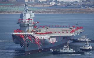 FILE PHOTO - China's first domestically built aircraft carrier is seen during its launch ceremony in Dalian, Liaoning province, China, April 26, 2017. To match Special Report CHINA-ARMY/NAVY REUTERS/Stringer/File Photo ATTENTION EDITORS - THIS IMAGE WAS P