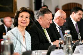 U.S. Secretary of State Mike Pompeo looks on next to U.S. Secretary of Transportation Elaine Chao during a CEO meeting in The Hague, Netherlands June 3, 2019. REUTERS/Piroschka Van De Wouw