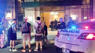 People and police officers stand outside Trump Plaza after a car crashed into the building's lobby in New Rochelle, New York, U.S., September 17, 2019, in this still image from video obtained via social media. Jose Abarca via REUTERS