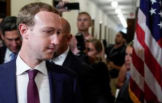 Facebook Chief Executive Mark Zuckerberg walks past members of the news media as he enters the office of U.S. Senator Josh Hawley (R-MO) while meeting with lawmakers to discuss 