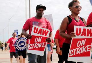 General Motors Detroit-Hamtramck Assembly plant worker Pierre Duhart walks the picket line during the United Auto Workers (UAW) national strike in Hamtramck, Michigan, U.S., September 22, 2019. REUTERS/Rebecca Cook