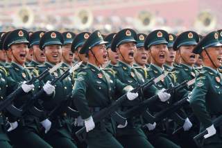 Soldiers of People's Liberation Army (PLA) march in formation during the military parade marking the 70th founding anniversary of People's Republic of China, on its National Day in Beijing, China October 1, 2019. REUTERS/Thomas Peter