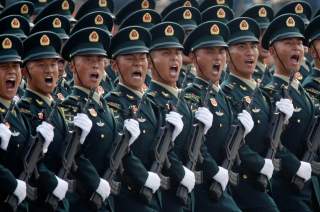 Soldiers of People's Liberation Army (PLA) march in formation past Tiananmen Square during the military parade marking the 70th founding anniversary of People's Republic of China, on its National Day in Beijing, China October 1, 2019. REUTERS/Jason Lee