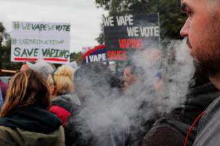 A demonstrator vapes during a protest at the Massachusetts State House against the state’s four-month ban of all vaping product sales in Boston, Massachusetts, U.S., October 3, 2019. REUTERS/Brian Snyder