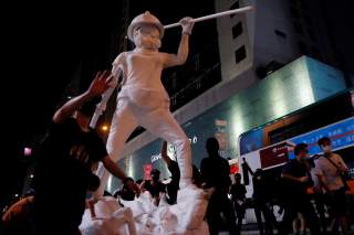 A 4m tall ‘Statue of Lady Liberty Hong Kong’ is seen during a demonstration after a government’s ban on face masks under emergency law, at Mong Kok, in Hong Kong, China, October 4, 2019. REUTERS/Tyrone Siu