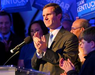 Kentucky's Attorney General Andy Beshear, running for governor against Republican incumbent Matt Bevin, reacts to statewide election results at his watch party in Louisville, Kentucky, U.S., November 5, 2019. REUTERS/Harrison McClary
