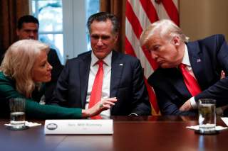 From left: White House counselor Kellyanne Conway speaks to Senator Mitt Romney (R-UT) and U.S. President Donald Trump, during a listening session on youth vaping and the electronic cigarette epidemic inside the Cabinet Room at the White House