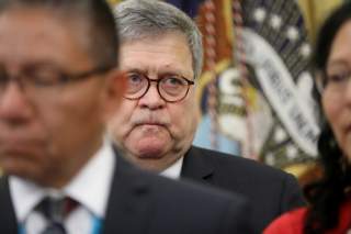 U.S. Attorney General Bill Barr attends as U.S. President Donald Trump signs an Executive Order on Missing and Murdered Native Americans in the Oval Office of the White House in Washington, U.S., November 26, 2019. REUTERS/Jonathan Ernst