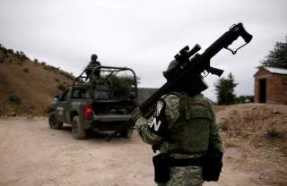 Soldiers assigned to the National Guard are seen while giving protection for the caravan of relatives on their journey to bury Rhonita Miller-Lebaron and Dawna Ray Langford and their children who were killed by unknown assailants, in Bavispe, Sonora state