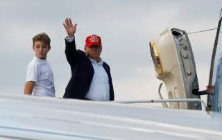 U.S. President Donald Trump and his son Barron board Air Force One en route to Washington after a Thanksgiving vacation, at Palm Beach International Airport in Florida, U.S., December 1, 2019. REUTERS/Yuri Gripas