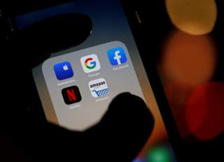 The logos of mobile apps, Google, Amazon, Facebook, Apple and Netflix, are displayed on a screen in this illustration picture taken December 3, 2019. REUTERS/Regis Duvignau