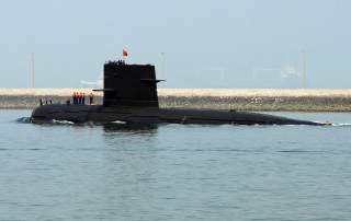 A Chinese navy submarine leaves Qingdao Port, Shandong province April 22, 2009. China will show off its resurgent naval strength this week at a parade marking 60 years since the founding of its navy, presenting its fleet of warships and nuclear submarines