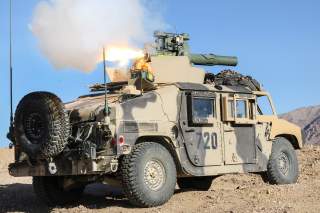  A soldier fires a Tube-launched, Optical tracked, Wire-guided missile from a Humvee, engaging Blue Force soldiers from the observation point Furlong during the Blackhorse Regiment’s defense of the Whale Gap during an exercise at Fort Irwin, Calif.
