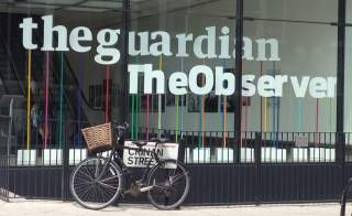 Window of the building housing The Guardian newspaper, London England.