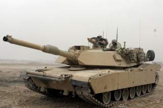 https://upload.wikimedia.org/wikipedia/commons/2/23/M1A1_Abrams_Tank_in_Camp_Fallujah.JPEG