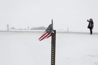 An American flag sits on a pole outside a campaign event for Democratic 2020 U.S. presidential candidate and former U.S. Vice President Joe Biden at the VFW Post 7920 in Osage, Iowa, U.S., January 22, 2020. REUTERS/Shannon Stapleton
