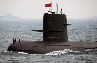 FILE PHOTO - A Chinese Navy submarine takes part in an international fleet review to celebrate the 60th anniversary of the founding of the People's Liberation Army (PLA) Navy in Qingdao, Shandong province, China April 23, 2009. To match Special Report CHI