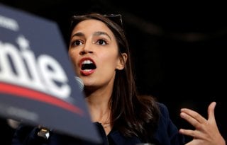 U.S. Representative Alexandria Ocasio Cortez (D-NY) speaks to introduce Democratic U.S. presidential candidate Senator Bernie Sanders at a campaign rally and concert at the University of New Hampshire one day before the New Hampshire presidential primary 