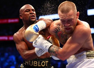 Aug 26, 2017; Las Vegas, NV, USA; Floyd Mayweather Jr. lands a hit against Conor McGregor during their boxing match at the at T-Mobile Arena. Mandatory Credit: Mark J. Rebilas-USA TODAY Sports TPX IMAGES OF THE DAY