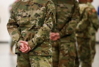 U.S. Army soldiers stand by as Army Chief of Staff General James McConville arrives at a military field hospital for non-coronavirus patients inside CenturyLink Field Event Center during the coronavirus disease (COVID-19) outbreak in Seattle, Washington, 