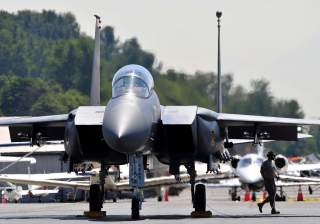 A crew chief from the 391st Aircraft Maintenance Unit finishes checking an F-15E Strike Eagle from the 391st Fighter Squadron before it performs at the Seafair Hydroplane Races and Air Show in Seattle July 30 through Aug. 2, 2010. 