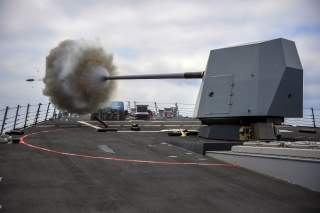 The Arleigh Burke-class guided-missile destroyer USS Bainbridge (DDG 96) fires its Mark 45 five-inch gun during a live-fire exercise. Bainbridge, homeported at Naval Station Norfolk, is conducting naval operations in the U.S. 6th Fleet area of operations
