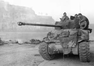 English: BRITISH TANK PATROLLING THE MEUSE AT NAMUR