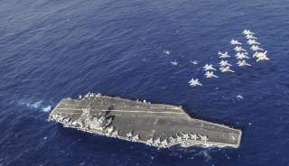 Aircraft assigned to Carrier Air Wing (CVW) 11 perform a fly-by performance for Sailors and their family members on a tiger cruise aboard the aircraft carrier USS Nimitz (CVN 68)