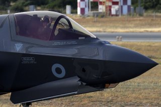 A pilot in a F-35B aircraft waves after landing at the Akrotiri Royal Air Forces base before landing, near city of Limassol