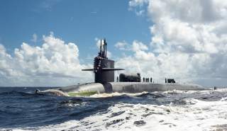The Ohio-class guided-missile submarine USS Georgia (SSGN 729) transits the Saint Marys River.