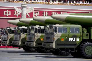 Military vehicles carrying DF-26 ballistic missiles travel past Tiananmen Gate during a military parade to commemorate the 70th anniversary of the end of World War II in Beijing Thursday Sept. 3, 2015. 