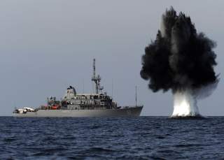STRAIT OF HORMUZ (Nov. 19, 2010) A demolition charge detonates 1,500 meters from the Avenger-class mine countermeasures ship USS Scout (MCM 8).